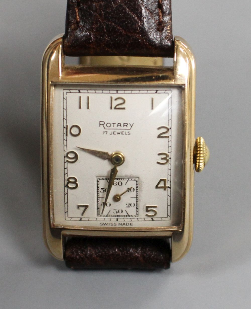 A gentlemans early 1950s 9ct gold Rotary manual wind wrist watch, the rectangular dial with Arabic numerals and subsidiary seconds,